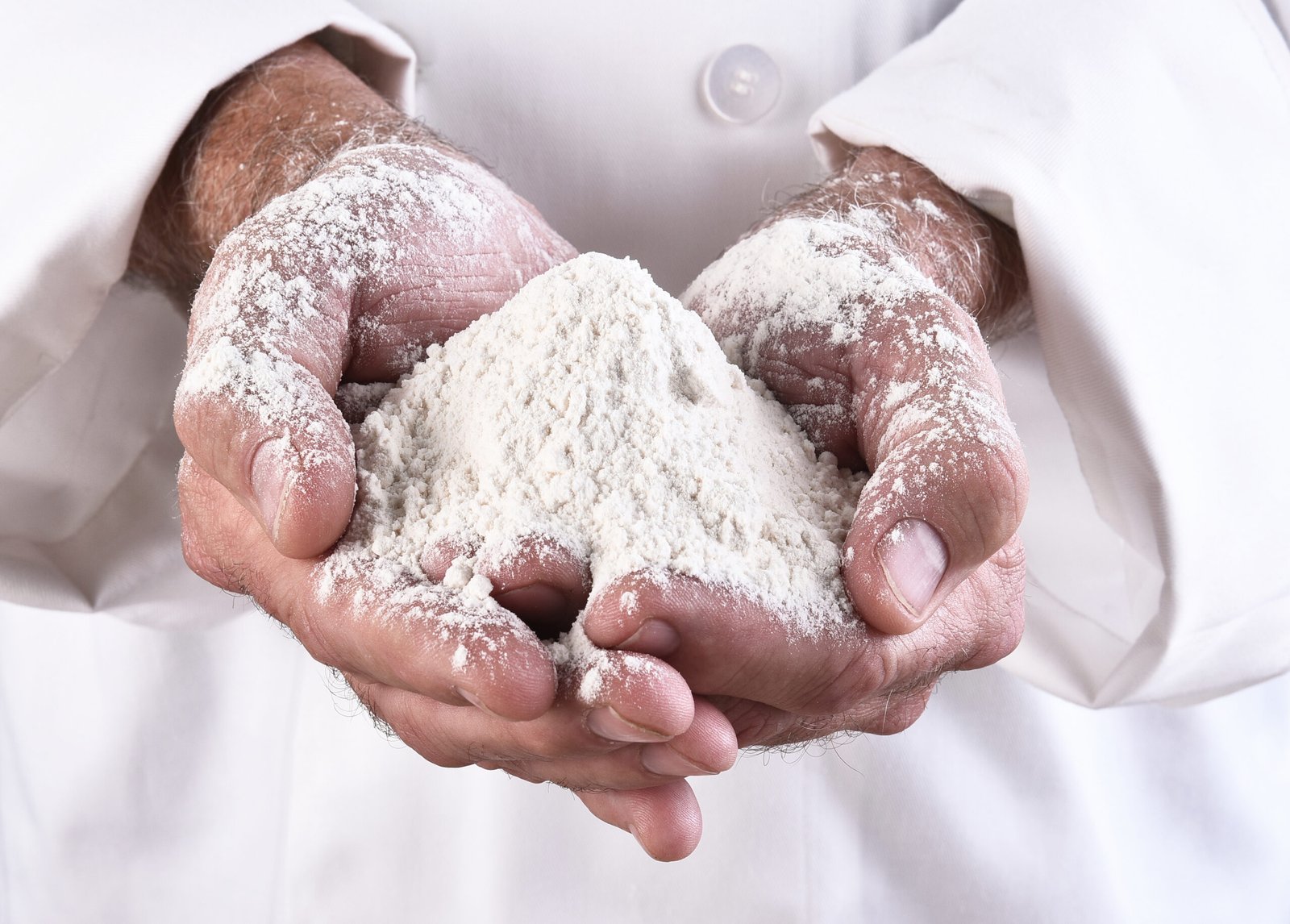 closeup-of-a-chef-holding-a-two-handfuls-of-flour-2025-10-16-06-19-36-utc